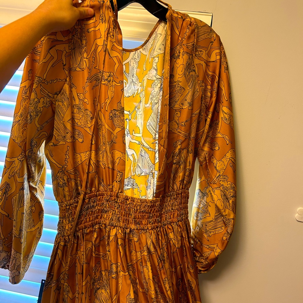 Beautiful gold silk Rhode dress with an open back